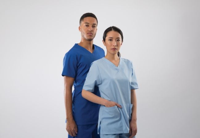 Two nurses wearing Alexandra Workwear scrubs